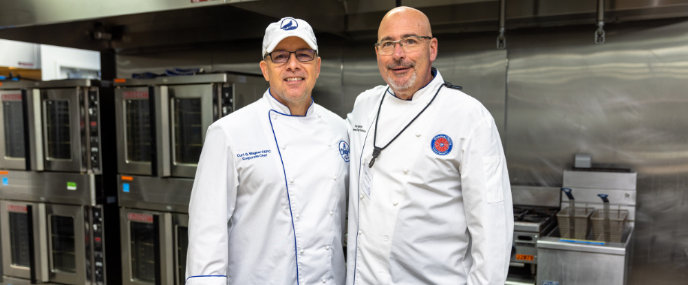 Two Chef’s in white coat.